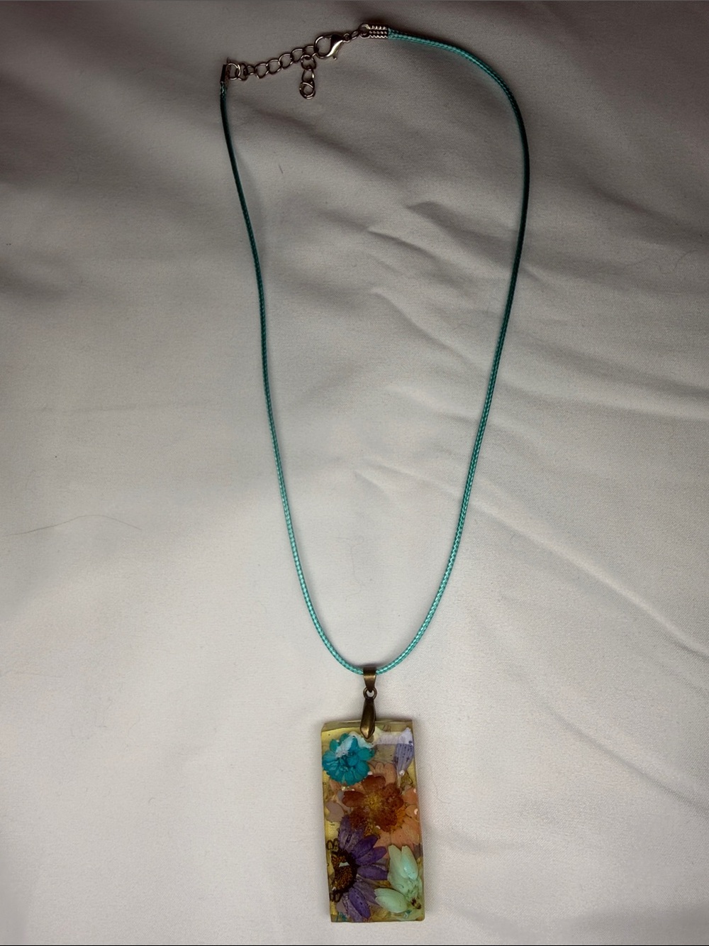 Women’s Turquoise Cord Necklace with Floral Resin Pendant